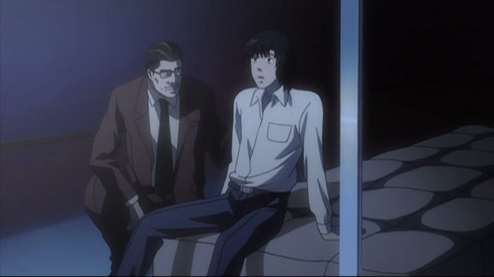 Death Note Ep 19 - Touta Matsuda on the mattress, where he's landed without injury. Soichiro Yagami looks on.