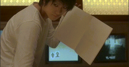 L with his name in a Death Note